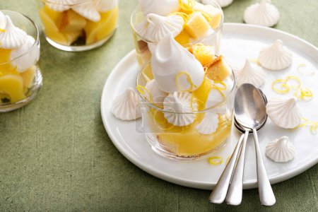 Photo for Lemon meringue parfait or trifle with pound cake, whipped cream and lemon curd - Royalty Free Image