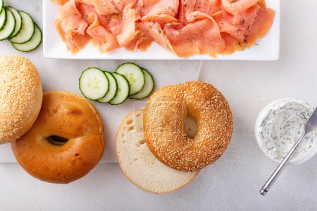 Bagels served with cream cheese, smoked salmon and fresh cucumber, sesame lox bagels
