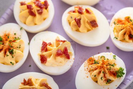 Deviled eggs with paprika and bacon, appetizer idea for Easter brunch