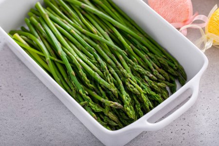 Blanched young asparagus in a baking pan, recipe for Easter brunch or dinner