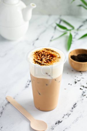Creme brulee milk tea with cold foam and caramelized sugar on top