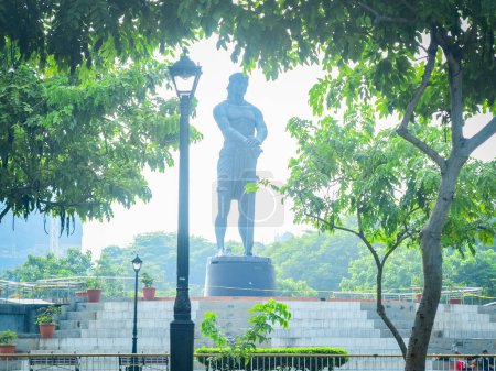 Photo for Rizal Park, Manila, Philippines July 2, 2014: The Lapu-lapu monument in front of the Department of Tourism Building located beside Rizal Park along Taft Ave., Manila, Philippines - Royalty Free Image