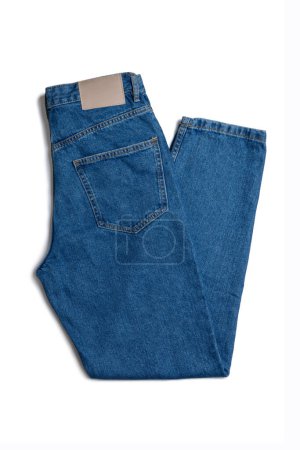 Foto de Blue jeans pants isolated on white background. Denim background, texture. Fashion concept, business, shopping, sale. Design detail, button and seams - Imagen libre de derechos