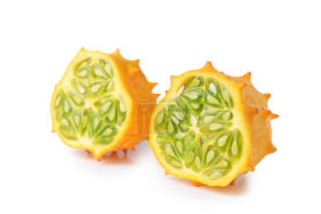 Photo for Kiwano fruit, green horned melon isolated on white background. Organic orange kiwano, African horned melon slices with green, jelly like inside with seeds close up. - Royalty Free Image