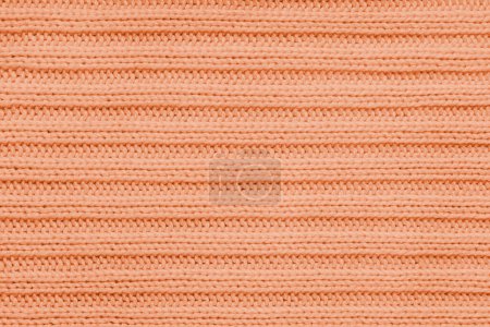 Fondo textil Jersey, tejido de punto rayado naranja. Prendas de punto de lana, suéter, textura de la superficie del jersey, estructura textil, superficie del paño, tejido de material de punto. Fondo de pantalla, telón de fondo.
