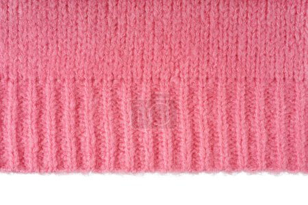 Pink knitted woolen jersey fabric, sweater, pullover texture with edge isolated on white background. Fabric abstract backdrop, cloth wallpaper