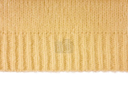 Yellow knitted woolen jersey fabric, sweater, pullover texture with edge isolated on white background. Fabric abstract backdrop, cloth wallpaper