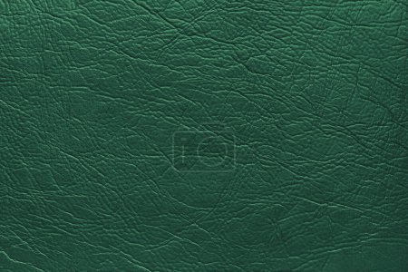 Genuine green leather texture, natural animal skin, luxury vintage cowhide background. Eco friendly leatherette, faux leather rough structure. Wallpapere, backdrop, copy space
