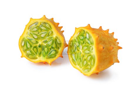 Kiwano fruit, green horned melon isolated on white background. Organic orange kiwano, African horned melon slices with green, jelly like inside with seeds close up.