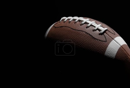 Photo for American football ball close up on black background. Horizontal sport theme poster, greeting cards, headers, website and app - Royalty Free Image