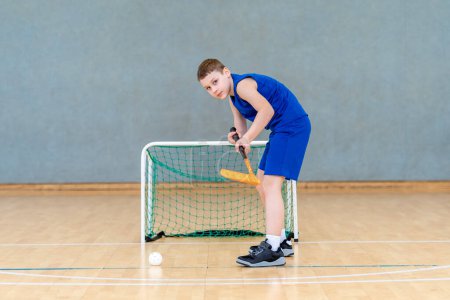 Floorball child boy player with stick and ball. Horizontal sport theme poster, greeting cards, headers, website and app