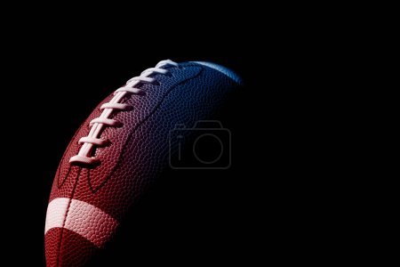 Neon American football ball close up on black background. Horizontal sport theme poster, greeting cards, headers, website and app