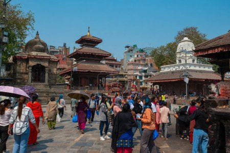 Photo for Kathmandu, Nepal - Apr 17, 2023: A landscape of Jagannath Temple, a Buddhist monastery located in Kathmandu Durbar Square, with tourists and locals visiting on a sunny day. - Royalty Free Image