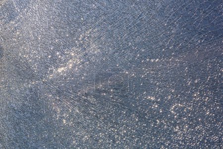 Photo for Cracks at tempered glass, spoiled glass surface, texture background, blind windscreen close-up, nobody. - Royalty Free Image
