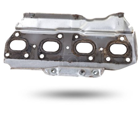 aluminum exhaust manifold gasket with heat shield between engine and muffler on white isolated background. Catalog of spare parts for cars.