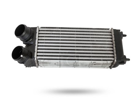 Car intercooler radiator for turbine cooling isolated on white background. Spare cooling system for internal combustion engine