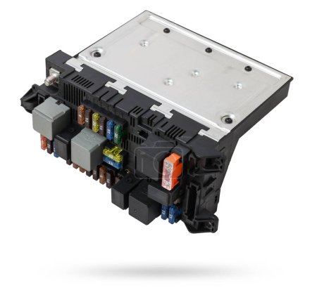 Metallic car engine control unit with plastic elements soaring on a white isolated background is connecting center of various subsystems, units and assemblies. Spare part.