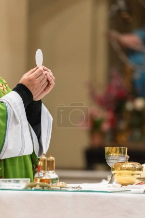 During the Mass, the rite of the Communion, for the Catholical Church