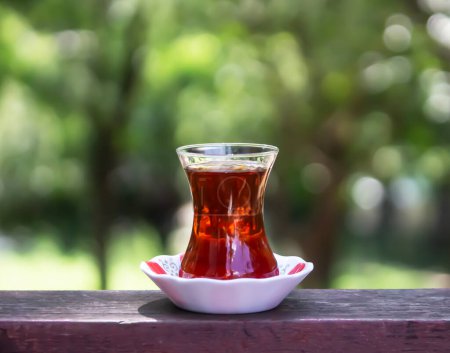 turkish tea on the table with blurred nature background. 