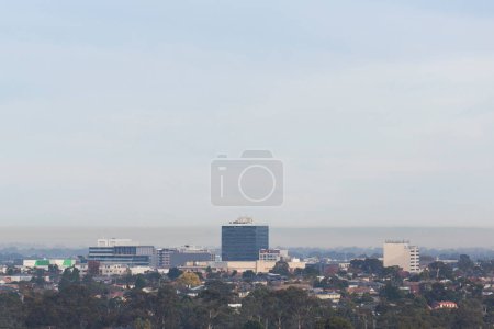 Photo for Aerial perspective of air pollution over cityscape, highlighting environmental issues. - Royalty Free Image