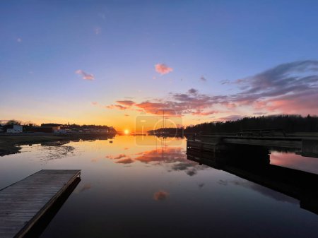 Photo for Sunset over Grisslehamn marina during a early summer evening. Sweden - Royalty Free Image