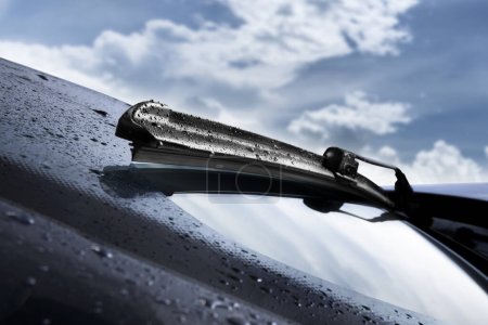 Photo for Closeup of wet windshield wiper, wipping windscreen outside - Royalty Free Image