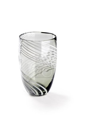Gray glass vase with decorative lines around, isolated
