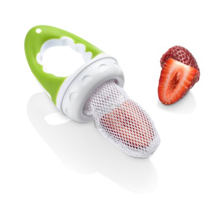 Baby fruit feeder with a strawberry inside the net isolated