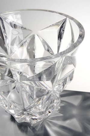 Transparent glass vase with edges, isolated