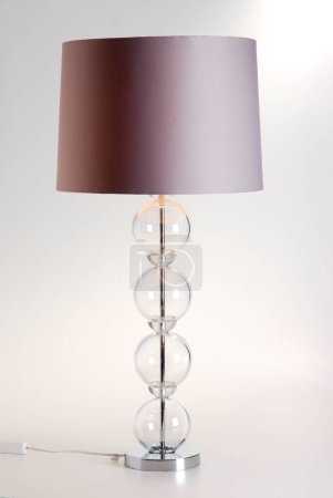 Modern metal and glass lamp, isolated 