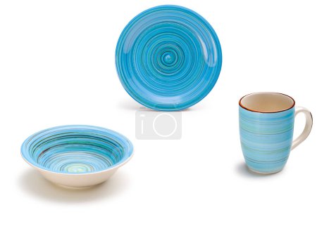 Fun cerulean blue ceramic kit with two plates and a mug, isolated on white