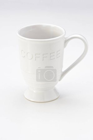 Big white ceramic coffee cup with handle, isolated on white