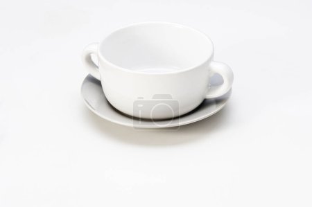 Photo for Simple white ceramic soup bowl with saucer, isolated on white - Royalty Free Image