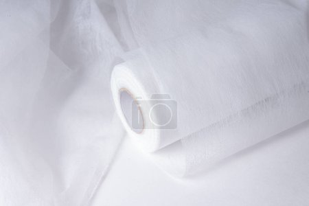 Non woven material, covering roll for medical bed