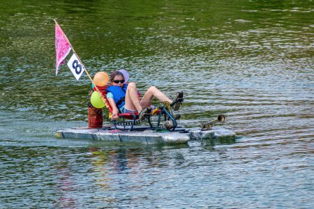 Photo for Breclav Czech Republic, 22.07.2023, Races of funny amateur vessels, neckyada. Arrival of an amateur vessel to the finish line - Royalty Free Image