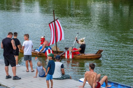 Photo for Breclav Czech Republic, 22.07.2023, Races of funny amateur vessels, neckyada. Finish line, Asterix and Obelix - Royalty Free Image