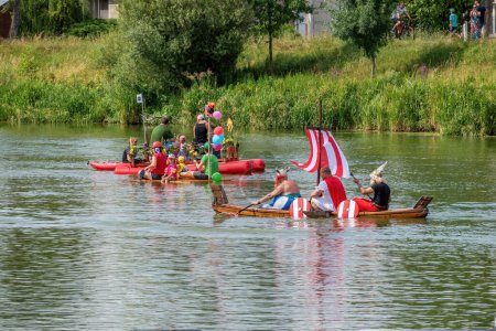 Photo for Breclav Czech Republic, 22.07.2023, Races of funny amateur vessels, neckyada. Two boats participating in amateur boat races - Royalty Free Image