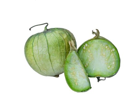 Photo for Physalis philadelphica. Tomatillo or Mexican husk tomato. Fresh organic green tomatillos (Physalis philadelphica) with a husk. One whole isolated on white and one half of it - Royalty Free Image