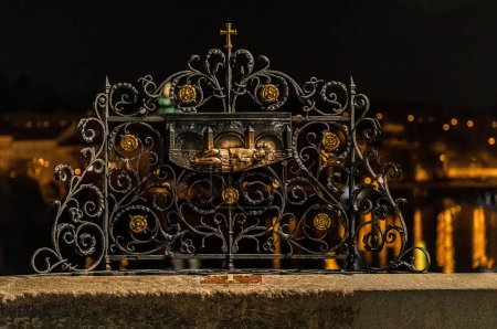Photo for Czech Republic, Prague. 05. 04. 2019: fragment of an attraction with lovers' locks on Charles Bridge. fragment rubbed to shine by hands of tourists - Royalty Free Image