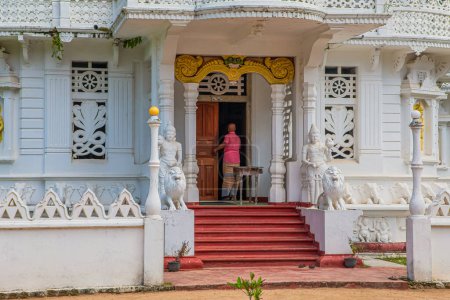 Photo for Balapitya Purana Viharay, Sri Lanka. 07. 02. 2023 Sri Pushparama temple low white multi-tiered building of an old construction, looks lacy. White Buddhist temple - Royalty Free Image