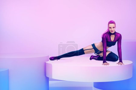 Photo for Full length portrait of attractive woman with healthy slim body over neon colored studio background. Concept of art, sports, fitness, ballet, dance. - Royalty Free Image