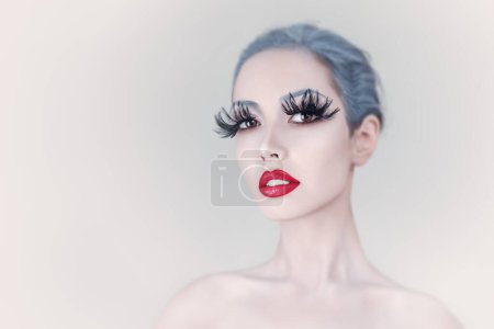 Photo for Young Woman Portrait with Creative Fashion Feather Eyelashes Make-Up - Royalty Free Image
