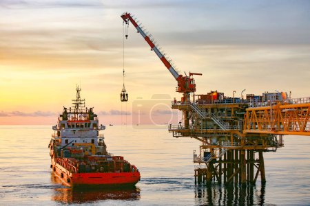 Photo for Offshore oil and gas industry and operated by technician petroleum. Worker walking to oil and gas plant for work as routine plan. Maintenance and Operation work scope in oil and gas plant. - Royalty Free Image
