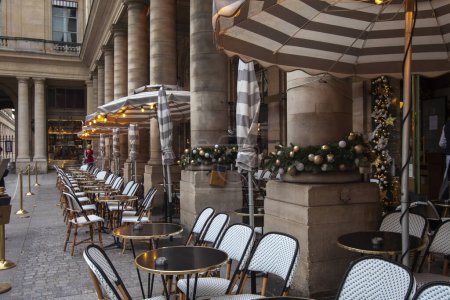 Photo for PARIS, FRANCE - December 01, 2023: Fashionable brasserie with terrace serving breakfast, French baguette sandwiches, snacks and drinks - Le Nemours - Royalty Free Image
