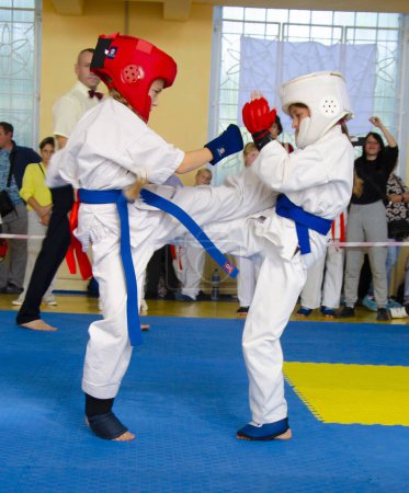Photo for Tournament competition in Kyokushinkai karate, the duel of athletes took place in Ukraine, Dnepropetrovsk region, Kamenskoye city 10/08/2022 - Royalty Free Image