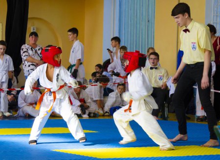 Photo for Tournament competition in Kyokushinkai karate, the duel of athletes took place in Ukraine, Dnepropetrovsk region, Kamenskoye city 10/08/2022 - Royalty Free Image