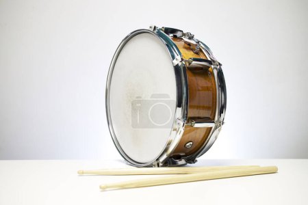 snare drum with drumsticks isolated on white background