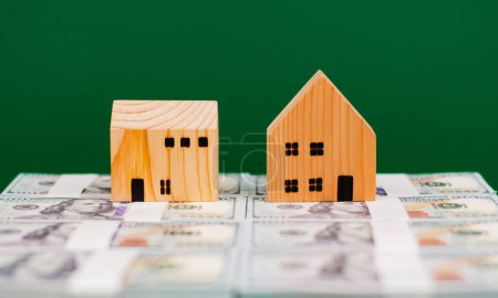 Photo for Money and houses are valuable assets. Financial wealth and time freedom Home Loan Home Loan First Home Home Sale Home Buying - Royalty Free Image