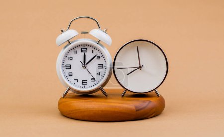 Photo for Modern alarm clock placed on a wooden plan Time clock, notifications, alarms time and work concept - Royalty Free Image