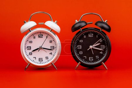 Photo for Alarm clock, modern clock, work with time, appointments, punctuality, rules of time, stationary clock hands. The importance of time and lifestyle - Royalty Free Image